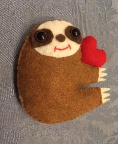Auburn sloth with heart